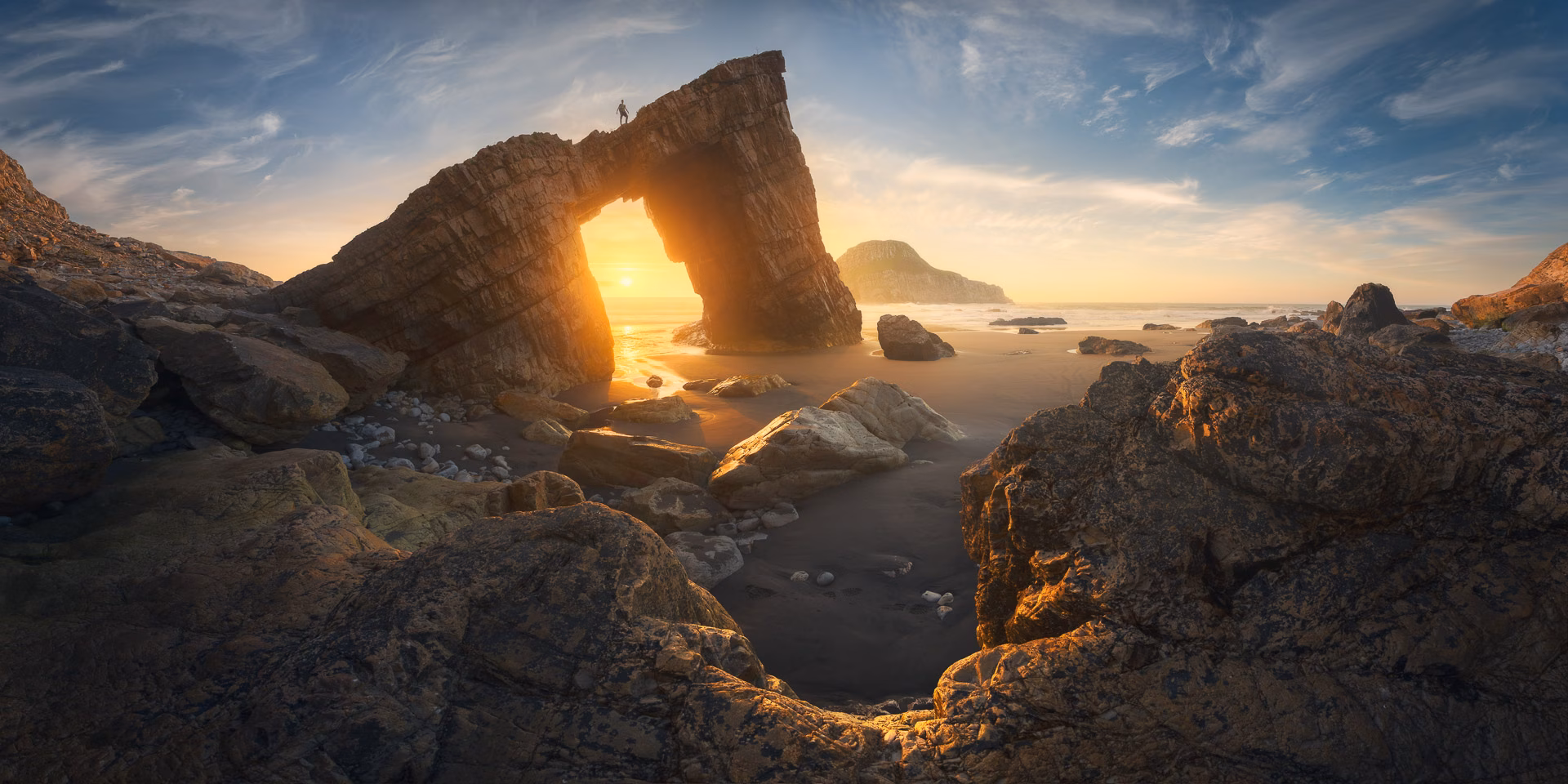 asturia-arch-sunset-pano-alex-wides.avif